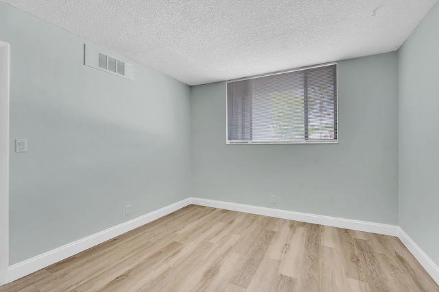 4345 Trevi Ct Unit 108, Lake Worth, FL 33467 - unfurnished room with wood finished floors and a textured ceiling