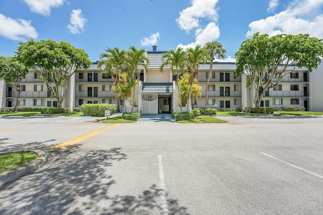 4345 Trevi Ct Unit 108, Lake Worth, FL 33467 - view of property featuring uncovered parking
