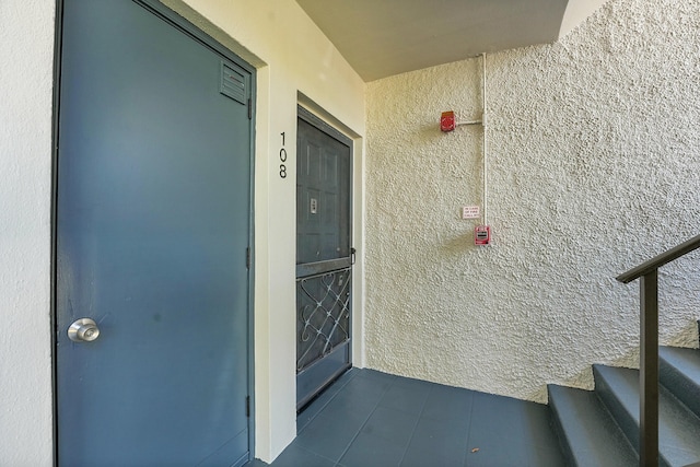 4345 Trevi Ct Unit 108, Lake Worth, FL 33467 - doorway to property with stucco siding