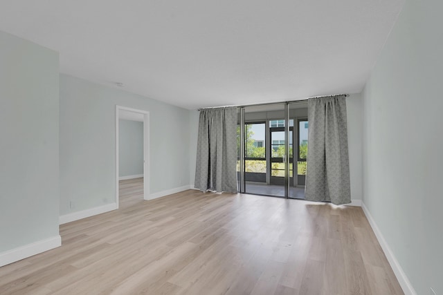 4345 Trevi Ct Unit 108, Lake Worth, FL 33467 - spare room featuring light wood-style floors and baseboards