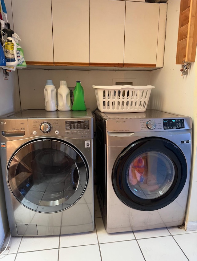 6807 Via Regina Unit 1, Boca Raton, FL 33433 - laundry room featuring washing machine and clothes dryer, cabinet space, and tile patterned flooring