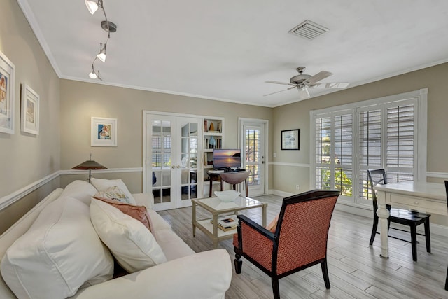 2940 SE Treasure Island Rd, Port Saint Lucie, FL 34952 - living room featuring french doors, visible vents, light wood-style floors, a ceiling fan, and rail lighting