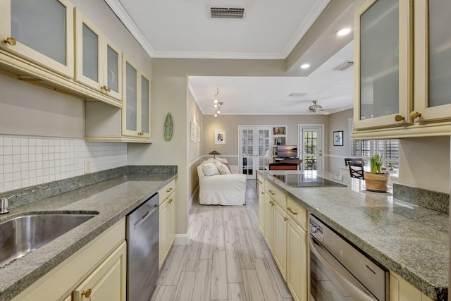 2940 SE Treasure Island Rd, Port Saint Lucie, FL 34952 - kitchen with visible vents, stainless steel dishwasher, ornamental molding, open floor plan, and cream cabinets