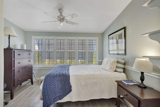 2940 SE Treasure Island Rd, Port Saint Lucie, FL 34952 - bedroom featuring lofted ceiling, baseboards, wood finished floors, and multiple windows