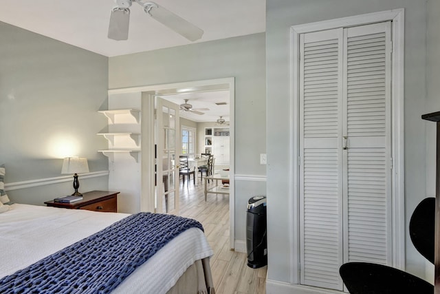 2940 SE Treasure Island Rd, Port Saint Lucie, FL 34952 - bedroom with ceiling fan, baseboards, light wood finished floors, and a closet