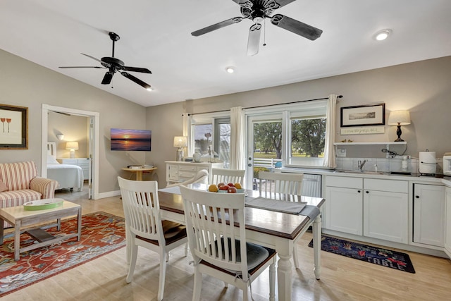 2940 SE Treasure Island Rd, Port Saint Lucie, FL 34952 - dining area featuring lofted ceiling, light wood-type flooring, and ceiling fan
