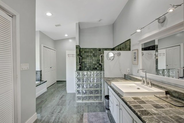 2940 SE Treasure Island Rd, Port Saint Lucie, FL 34952 - full bath with a tile shower, a washtub, vanity, a closet, and baseboards