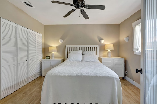 2940 SE Treasure Island Rd, Port Saint Lucie, FL 34952 - bedroom with a ceiling fan, a closet, visible vents, and light wood-type flooring
