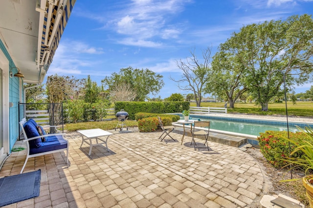 2940 SE Treasure Island Rd, Port Saint Lucie, FL 34952 - view of patio / terrace with an outdoor pool and a fenced backyard