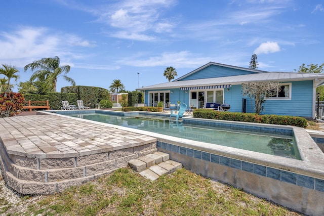 2940 SE Treasure Island Rd, Port Saint Lucie, FL 34952 - outdoor pool featuring a patio area and fence
