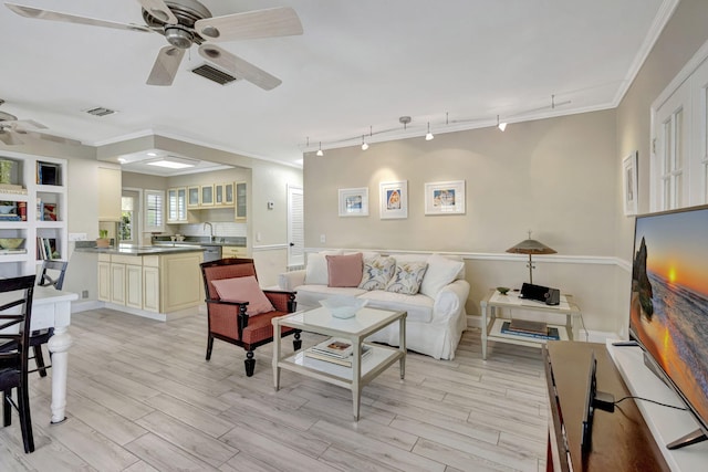 2940 SE Treasure Island Rd, Port Saint Lucie, FL 34952 - living room featuring ceiling fan, crown molding, visible vents, and light wood-type flooring