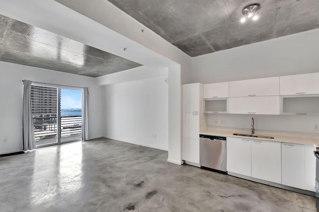 234 NE 3rd St Unit 2206, Miami, FL 33132 - kitchen with dishwasher, light countertops, white cabinets, and concrete floors