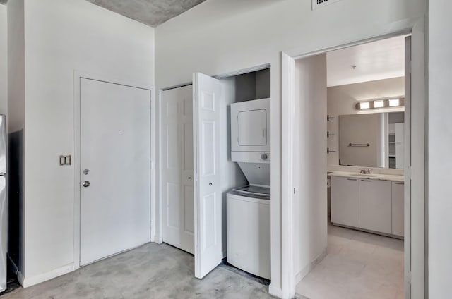 234 NE 3rd St Unit 2206, Miami, FL 33132 - laundry area featuring stacked washing machine and dryer