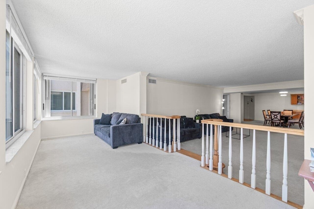 2000 S Ocean Blvd Unit 605, Delray Beach, FL 33483 - sitting room with a textured ceiling, carpet flooring, and baseboards