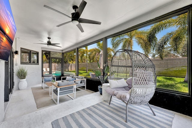 sunroom / solarium with outdoor lounge area, a ceiling fan, and a healthy amount of sunlight