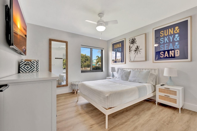 bedroom with light wood-style floors, baseboards, and ceiling fan