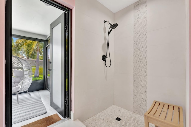 bathroom with a tile shower