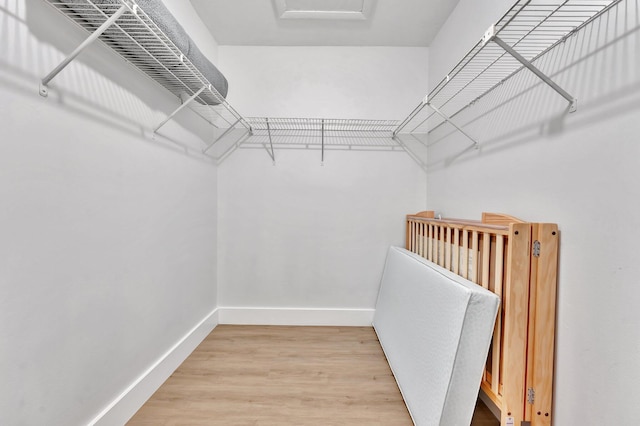 spacious closet with light wood-type flooring