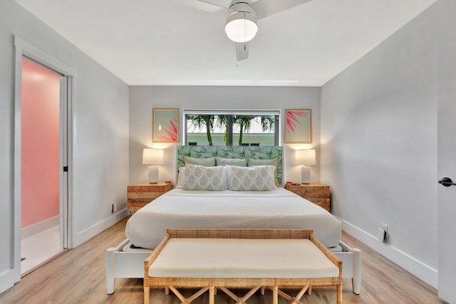 bedroom featuring baseboards, ceiling fan, and light wood-type flooring