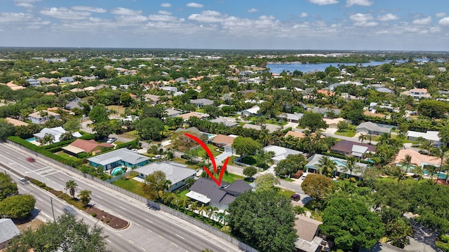 bird's eye view with a water view and a residential view