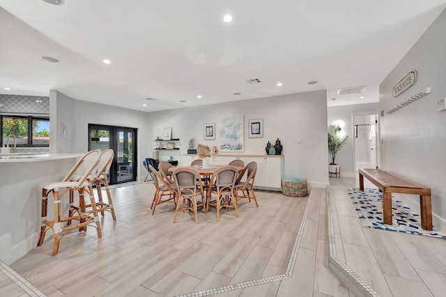 dining room with recessed lighting, wood tiled floor, and visible vents