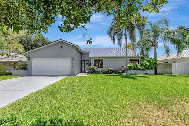 single story home with fence, an attached garage, concrete driveway, stucco siding, and a front yard