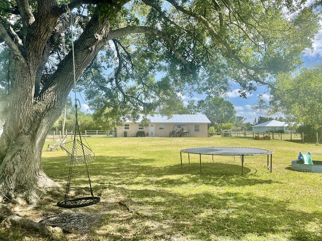 7677 NW 90th Ct, Okeechobee, FL 34972 - view of yard with a trampoline