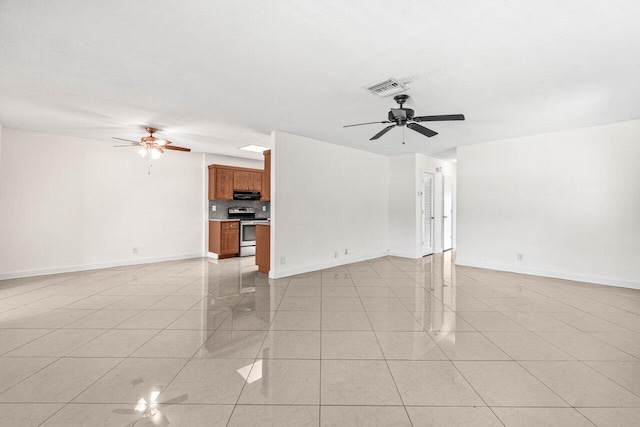 unfurnished living room featuring baseboards, ceiling fan, visible vents, and light tile patterned floors