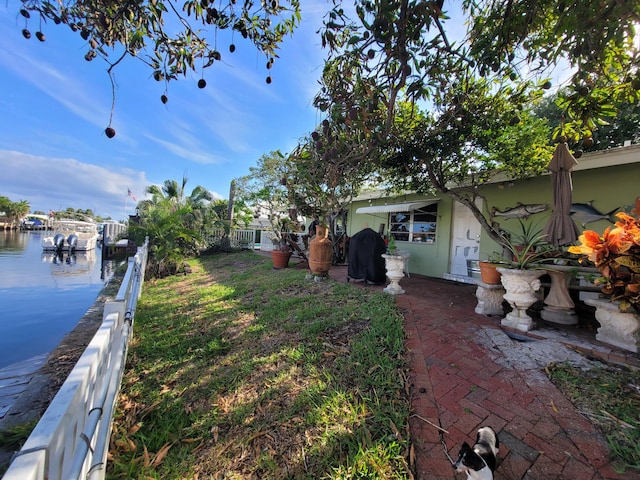 370 SE 14th Ave, Pompano Beach, FL 33060 - view of yard featuring a water view and a dock