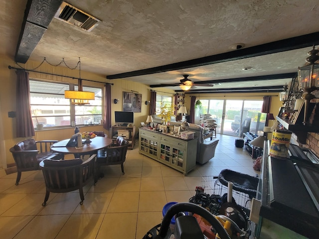 370 SE 14th Ave, Pompano Beach, FL 33060 - dining space featuring beamed ceiling, light tile patterned flooring, and ceiling fan
