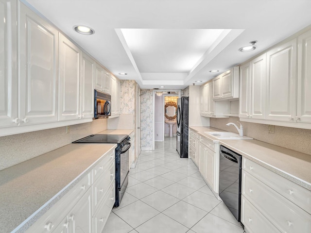4740 S Ocean Blvd Unit 606, Highland Beach, FL 33487 - kitchen with a sink, light countertops, recessed lighting, light tile patterned floors, and black appliances