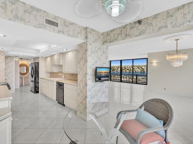4740 S Ocean Blvd Unit 606, Highland Beach, FL 33487 - kitchen featuring a sink, light countertops, black dishwasher, freestanding refrigerator, and visible vents