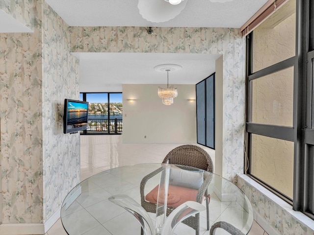 4740 S Ocean Blvd Unit 606, Highland Beach, FL 33487 - tiled dining room featuring a chandelier