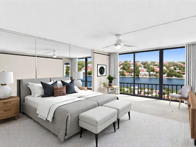 4740 S Ocean Blvd Unit 606, Highland Beach, FL 33487 - bedroom with access to exterior, ceiling fan, a water view, expansive windows, and carpet