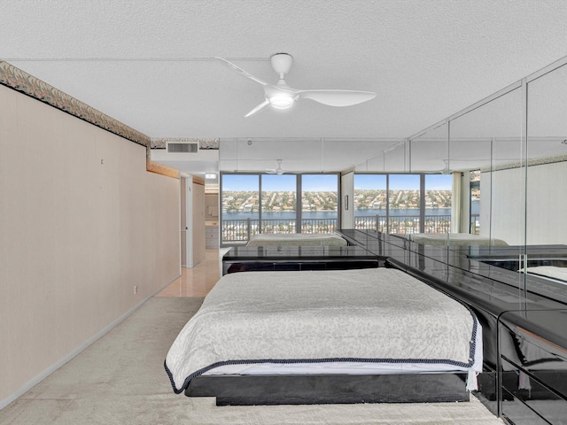 4740 S Ocean Blvd Unit 606, Highland Beach, FL 33487 - bedroom with visible vents, baseboards, light colored carpet, a water view, and expansive windows