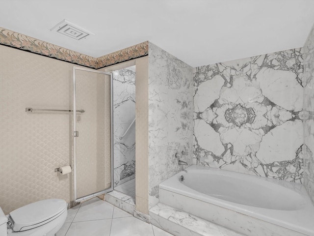4740 S Ocean Blvd Unit 606, Highland Beach, FL 33487 - full bathroom with tile patterned flooring, toilet, visible vents, a bath, and a stall shower