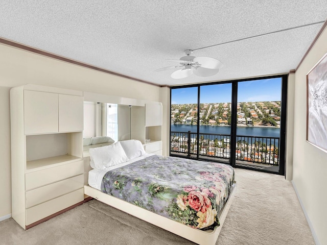 4740 S Ocean Blvd Unit 606, Highland Beach, FL 33487 - bedroom featuring a water view, light colored carpet, access to exterior, and multiple windows