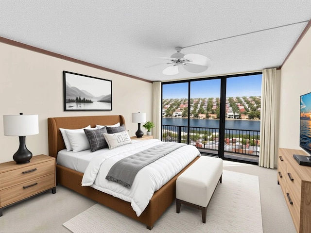 4740 S Ocean Blvd Unit 606, Highland Beach, FL 33487 - bedroom featuring a textured ceiling, floor to ceiling windows, access to exterior, and light carpet
