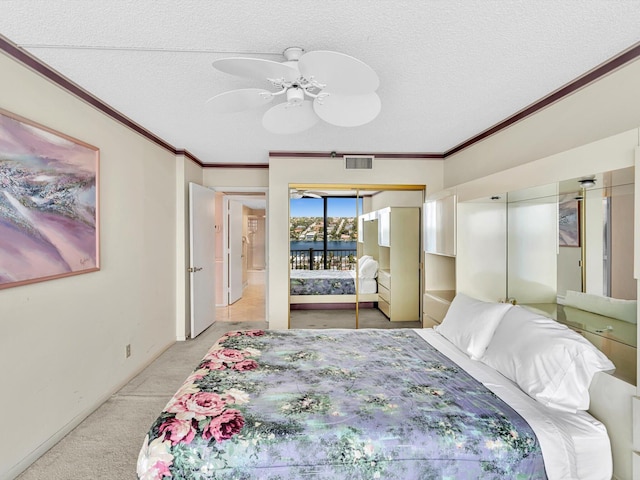 4740 S Ocean Blvd Unit 606, Highland Beach, FL 33487 - bedroom with visible vents, a textured ceiling, crown molding, and light carpet
