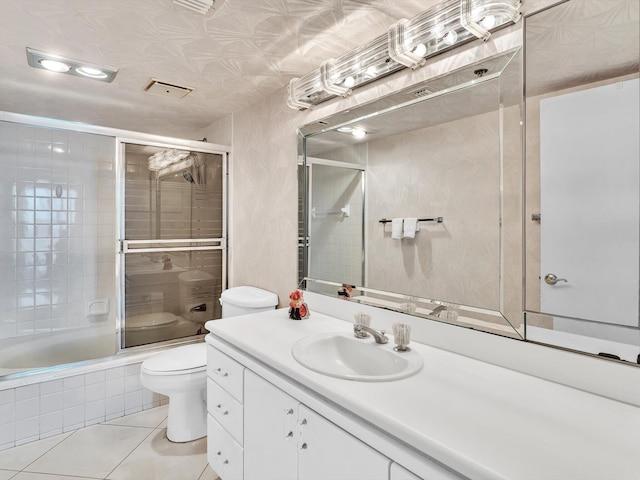 4740 S Ocean Blvd Unit 606, Highland Beach, FL 33487 - full bath featuring tiled shower / bath combo, vanity, tile patterned flooring, and toilet