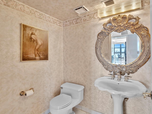 4740 S Ocean Blvd Unit 606, Highland Beach, FL 33487 - bathroom featuring tile patterned flooring, toilet, and visible vents