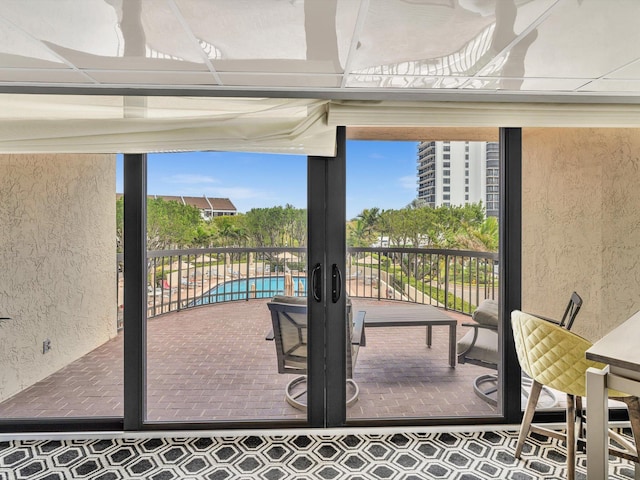 4740 S Ocean Blvd Unit 606, Highland Beach, FL 33487 - view of patio with a fenced in pool and a balcony