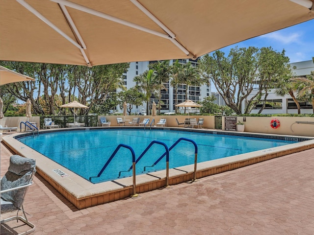 4740 S Ocean Blvd Unit 606, Highland Beach, FL 33487 - pool featuring a patio and fence