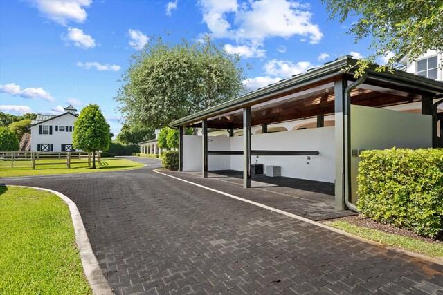 view of street with decorative driveway