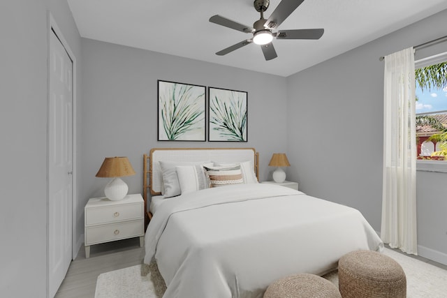 324 Bayfront Dr, Boynton Beach, FL 33435 - bedroom with baseboards, a ceiling fan, and light wood finished floors