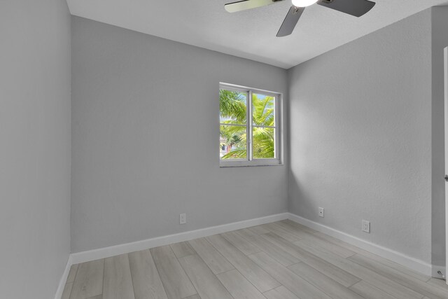 324 Bayfront Dr, Boynton Beach, FL 33435 - unfurnished room with baseboards, wood finished floors, and ceiling fan