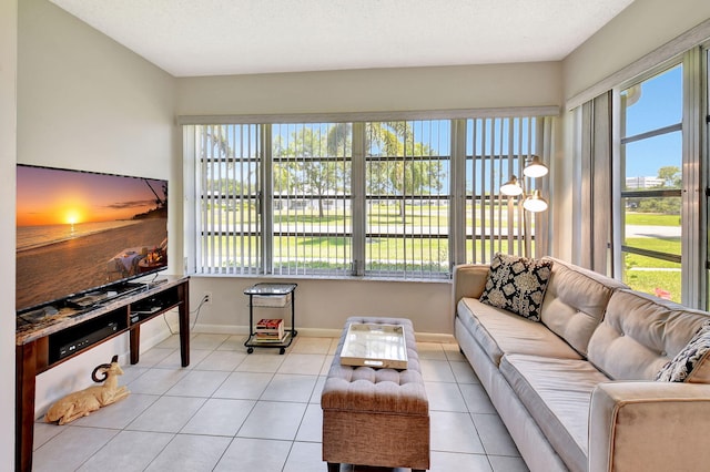 14699 Canalview C Dr Unit C, Delray Beach, FL 33484 - living room featuring light tile patterned floors and baseboards