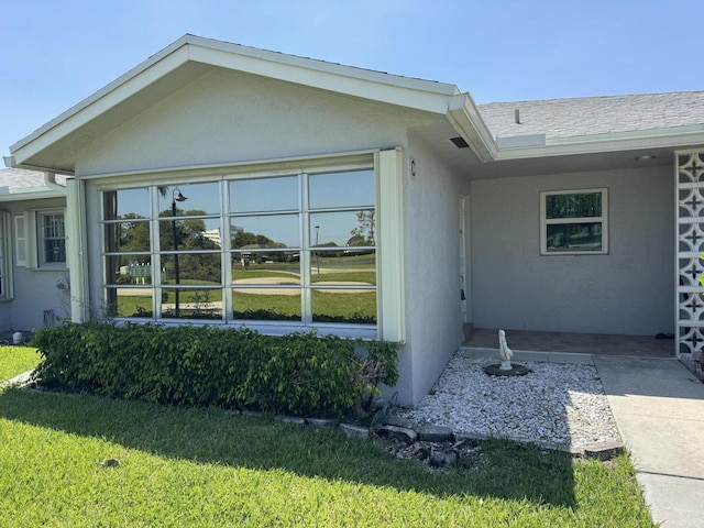 14699 Canalview C Dr Unit C, Delray Beach, FL 33484 - view of home's exterior with a lawn and stucco siding