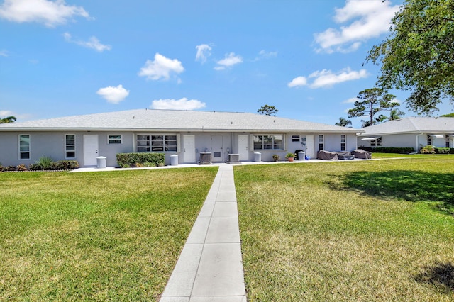 14699 Canalview C Dr Unit C, Delray Beach, FL 33484 - rear view of house with a yard, cooling unit, and stucco siding