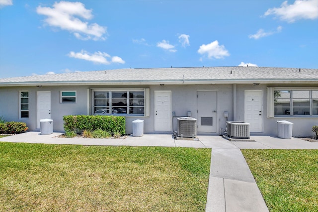 14699 Canalview C Dr Unit C, Delray Beach, FL 33484 - back of property with central air condition unit, a yard, and stucco siding